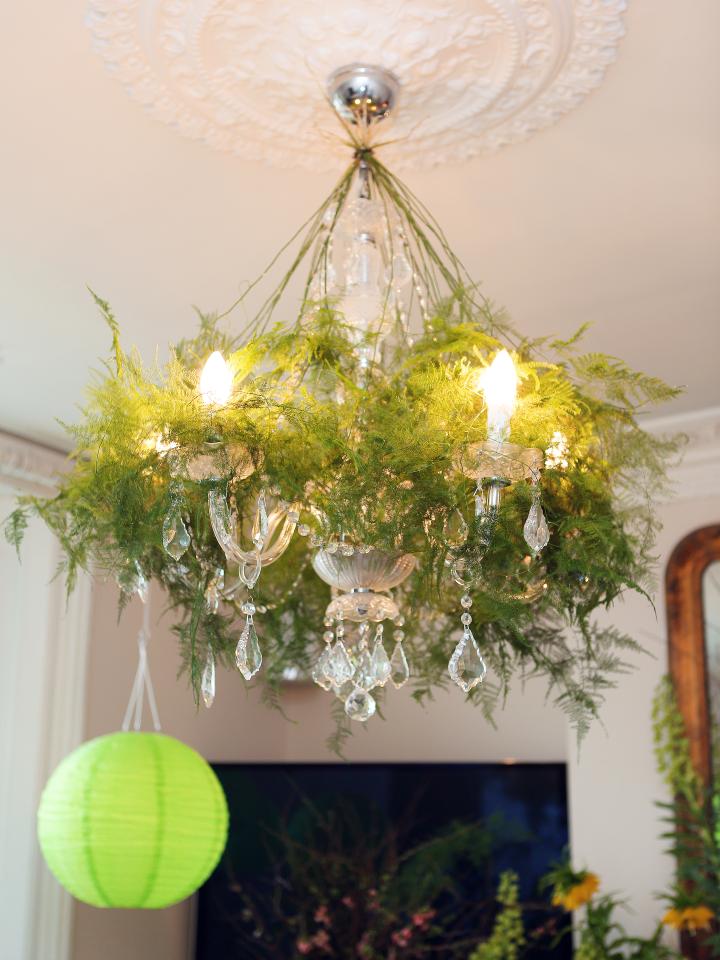 Weave fern leaves or ivy vines through a glass chandelier