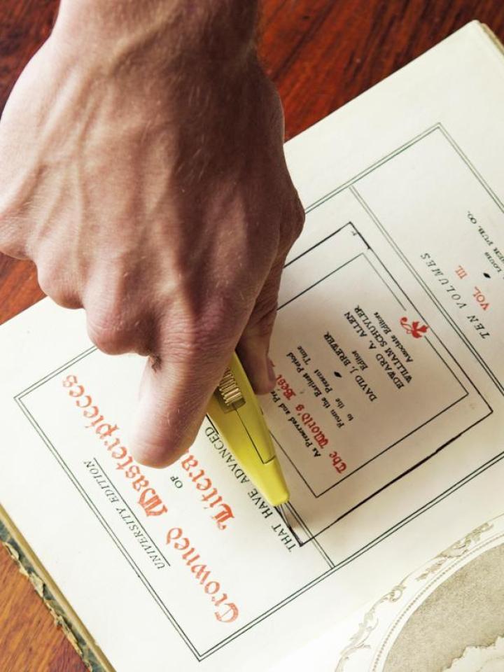 Cut out the centre of the book with a craft knife